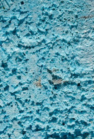 textura artística espuma de poliuretano azul en un corte con elementos de hormigón gris. Foto de alta calidad