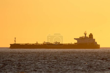 Photo for Tanker Saetta in dawn light on Skagerrak off Skagen, Denmark. - Royalty Free Image