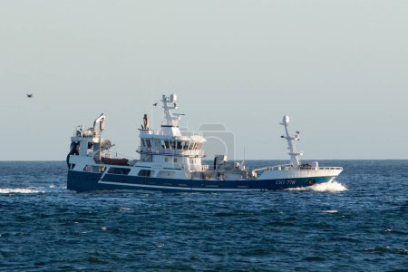 Photo for The Swedish trawler Lvn from Rnnng, fully loaded with catch, on its way to Skagen in Denmark. - Royalty Free Image