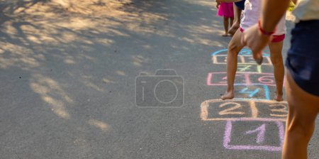 Photo for Children playing classics on the playground outdoors, children outdoors. Selective focus. nature - Royalty Free Image