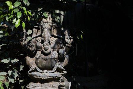Photo for Muenster, Germany - 07 30 2022: Statue of the indian god Ganesha in the form of an asian elephant sitting in yoga like pose - Royalty Free Image
