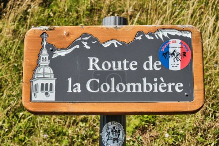 Wooden sign of Route de la Colombiere in the french alps