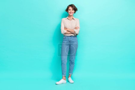 Full length photo of optimistic successful lady office manager wear fashionable comfort outfit good mood isolated on cyan color background.