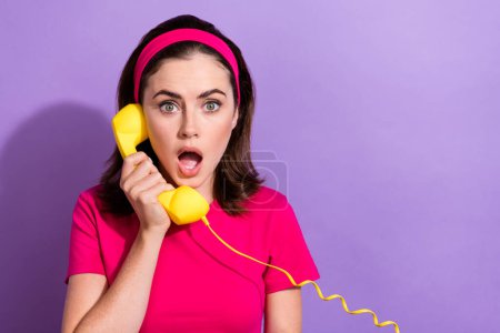 Photo of worried astonished lady hold phone impressed news information special offer deal isolated on purple color background.