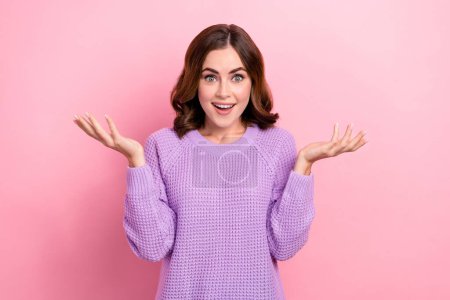 Photo of astonished lady wear violet trendy clothes impressed good news win lottery omg how it possible isolated on pink color background.