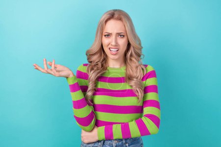 Photo of confused puzzled lady wear striped pullover not understand you isolated teal color background.