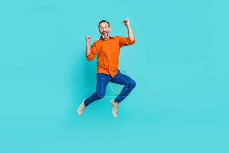 Full size body photo of crazy businessman jumper winner success achievement fists up triumphant isolated on aquamarine color background.