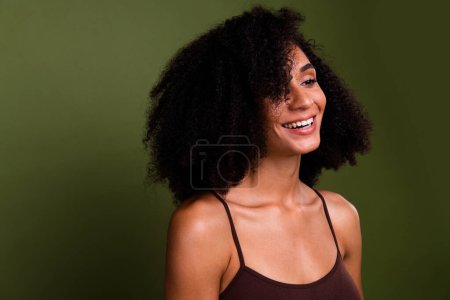 No filter studio photo of shiny positive woman wear lingerie laughing enjoying herself empty space isolated khaki color background.