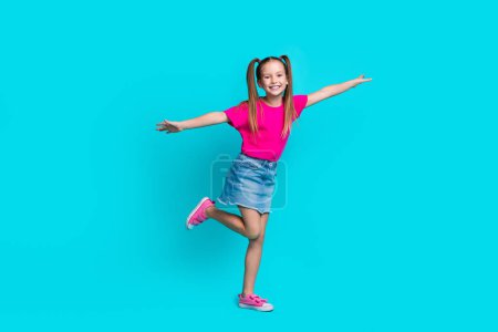 Full length photo of excited cheerful person hands wings have good mood isolated on blue color background.