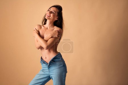Unretouched photo of body positive girl hug self chest smiling defeat breast cancer isolated pastel color background.