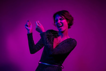 Photo portrait of lovely young lady hold excited plate empty space wear trendy overall garment isolated on neon light pink color background.
