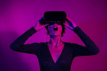Photo portrait of lovely young lady headset gamer virtual reality wear trendy overall garment isolated on neon light pink color background.