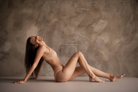 Full body photo of gorgeous smile brunette hair girl body positive model showing self love in lingerie isolated on gray color background.