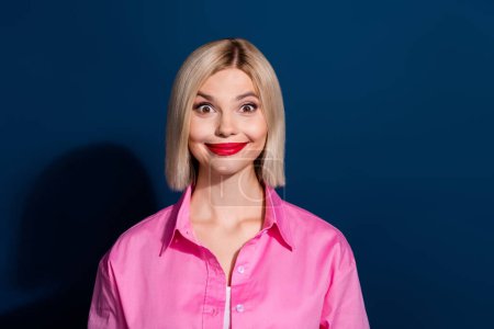 Photo of funky eccentric woman with bob hairstyle red lips dressed pink shirt staring at season sale isolated on dark blue background.