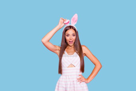 Ready prepare celebrate easter party Gorgeous nice stunning adorable person with her wide open mouth she hold element of fluffy costume on head isolated on pink background in white striped wear.