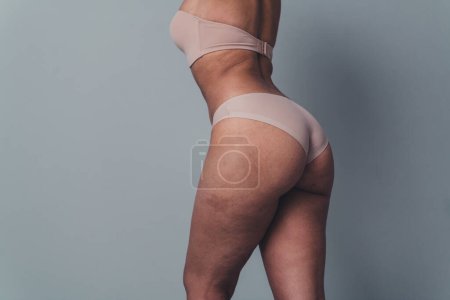 Unretouched cropped photo of woman stand back behind wearing comfortable underclothes panties love her body.