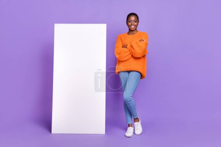 Full length photo of young pretty girl crossed hands promoter wear modern clothes isolated over purple color background.