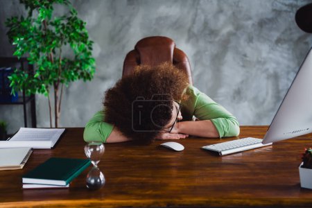 Photo of tired lovely sleepy woman relax rest hard work day sitting in modern chair workspace workstation.
