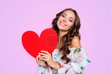Close up portrait of magnificent, exquisite, delicate, winsome, lovable, fascinating lady look at camera hold big paper card in hands isolated on vivid turquoise background.