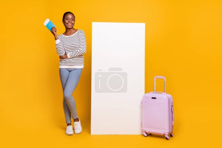 Full body photo of young lovely girl vacation check-in low-cost airport flight isolated over yellow color background.