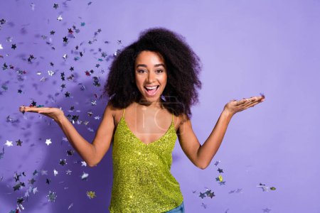 Photo portrait of gorgeous young girl dancing discotheque confetti wear trendy green sequins outfit isolated on purple color background.