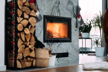 Photo for Fireplace at home decorated for christmas - Royalty Free Image