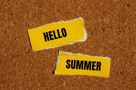 Hello summer words written on ripped yellow paper with brown bac