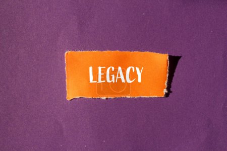 Legacy word written on ripped orange paper with purple backgroun