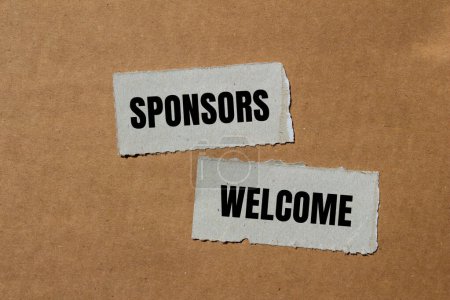 Sponsors welcome words written on ripped paper pieces with brown background. Conceptual business symbol. Copy space.