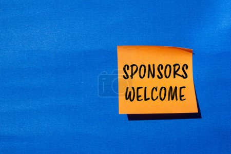 Sponsors welcome words written on orange paper sticker with blue background. Conceptual business symbol. Copy space.