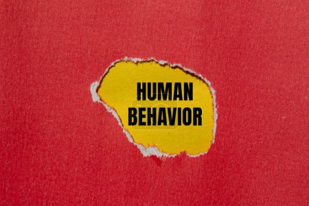 Photo for Human behavior words written on ripped red paper with yellow background. Conceptual human behavior symbol. Copy space. - Royalty Free Image