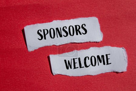 Sponsors welcome words written on ripped white paper pieces with red background. Conceptual sponsors welcome symbol. Copy space.