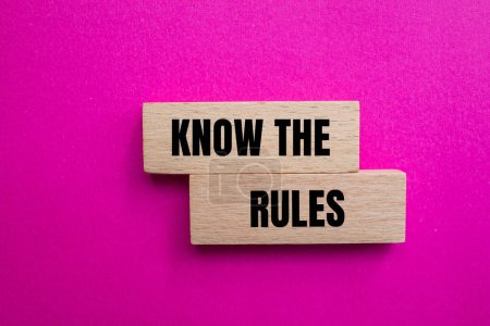 Photo for Know the rules words written on wooden blocks with pink background. Conceptual know the rules symbol. Copy space. - Royalty Free Image