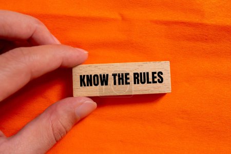Photo for Know the rules words written on wooden block with orange background. Conceptual know the rules symbol. Copy space. - Royalty Free Image