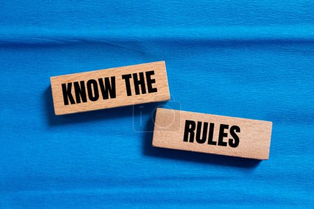 Photo for Know the rules words written on wooden blocks with blue background. Conceptual know the rules symbol. Copy space. - Royalty Free Image