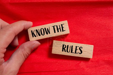 Photo for Know the rules words written on wooden blocks with red background. Conceptual know the rules symbol. Copy space. - Royalty Free Image