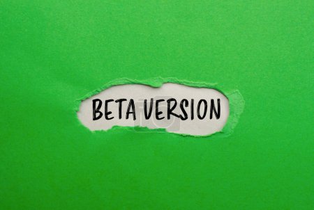 Beta version words written on ripped green paper with gray background. Conceptual beta version symbol. Copy space.