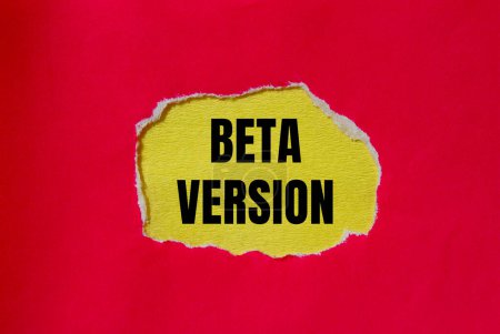 Beta version words written on ripped red paper with yellow background. Conceptual beta version symbol. Copy space.
