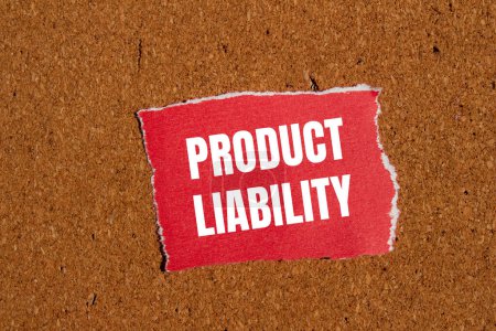 Product liability words written on ripped red paper piece with brown background. Conceptual product liability symbol. Copy space.