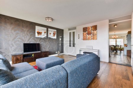 Photo for A living room with two couches and a flat screen tv on the wall in the room is very clean - Royalty Free Image