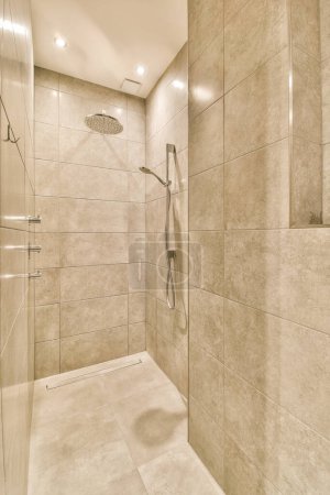 Photo for A walk in shower that is clean and ready to be used for the next days washrooms - Royalty Free Image