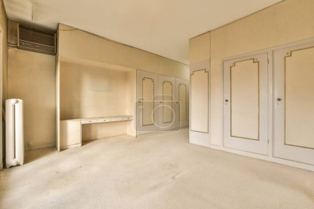 Photo for An empty room with white walls and no one person standing in the doorways or door to the other room - Royalty Free Image