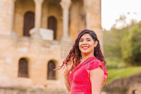 Photo for Venezuelan south american hispanic woman travel vacation in summer. pre-romanesque medieval unesco church. lifestyle outdoor with copy space. - Royalty Free Image