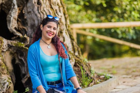 Photo for Portrait of mid adult woman smiling outside. Ethnic people in a medieval environment adventure - Royalty Free Image