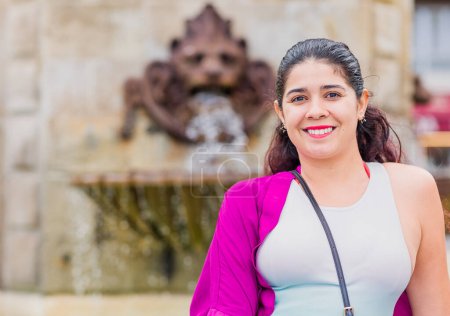 Photo for Lifestyle tourist vacation female looking at camera in European city in northern Spain. Outside happy person doing tourism outside - Royalty Free Image
