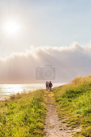 Photo for Finisterre Camino de los faros is a part of camino de Santiago is summer travel on the coastline view. Majestic outdoor heaven with beautiful sunlight sky background. Active retired trekking with copy - Royalty Free Image