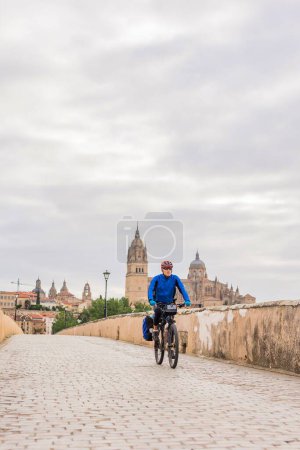 Photo for Senior tourism in famous place UNESCO Spanish town. Pilgrimage Christian route from Camino de Santiago road of xacobeo - Royalty Free Image