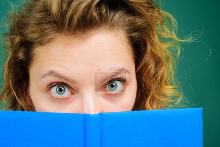 Photo for Closeup portrait of female teacher with class journal. School job. Education, learning. Back to school. Female college student hiding behind open book. Girl covering face with notebook. Knowledge day - Royalty Free Image