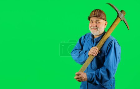 Photo for Smiling miner in uniform with pickaxe. Construction and building works. Bearded construction worker or craftsman in hard hat with pick-axe. Male laborer with building tool. Copy space for advertising - Royalty Free Image