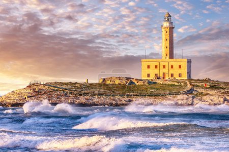 Photo for Stunning view on Lighthouse of Vieste, rising on the isle of Santa Eufemia. Lighthouse In Vieste, Gargano Peninsula, Apulia region, Italy, Europe - Royalty Free Image